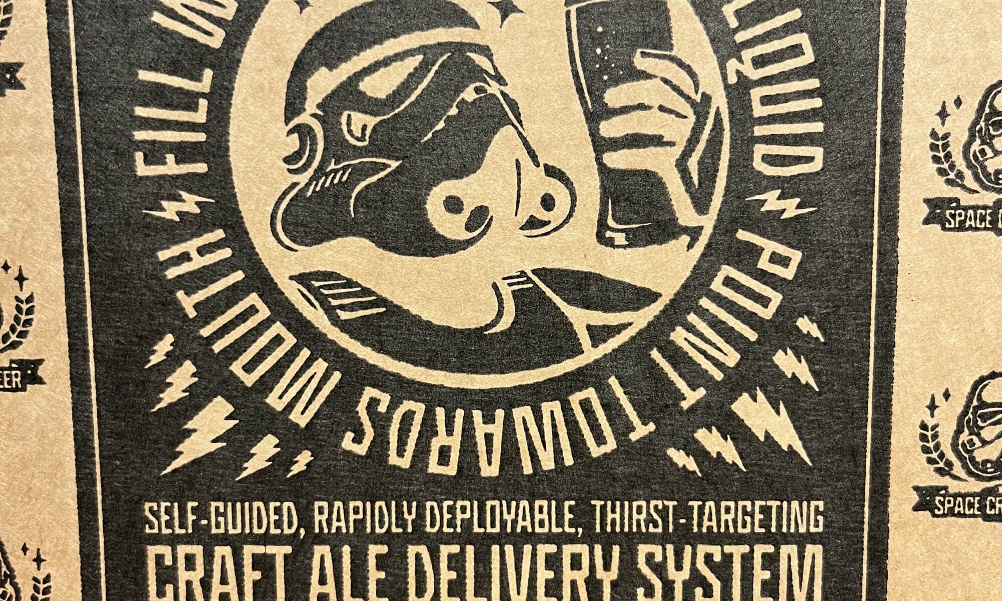 Picture of the box from a star-wars-themed craft ale kit. Features a graphic of a storm trooper holding a beer glass and the motto “Fill with aim-retarding liquid. Point towards mouth”