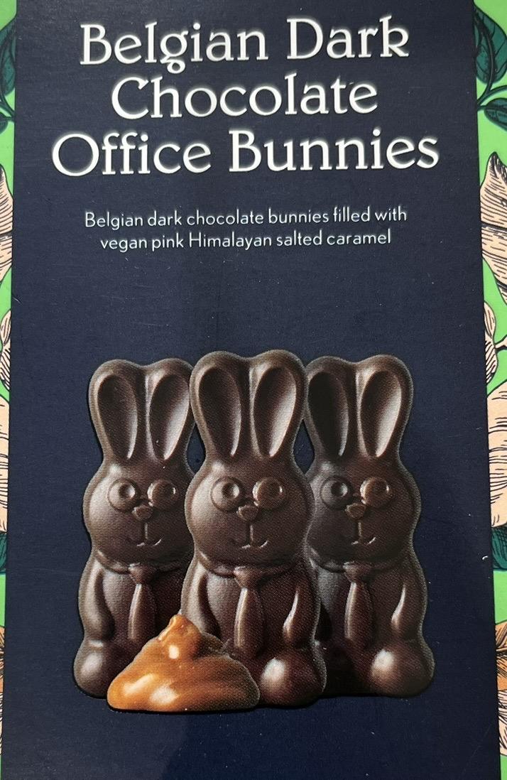 A photo of a packet of chocolate bunnies. Alongside the bunnies on the packaing is a small pile of a gooey brown substance.