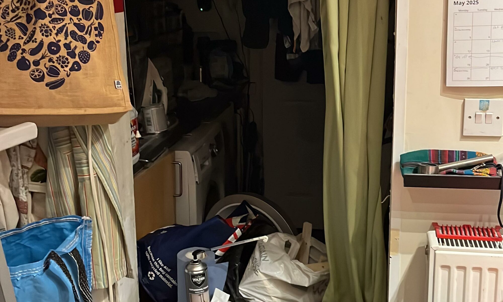 A messy ex-doorway with lots of clutter.