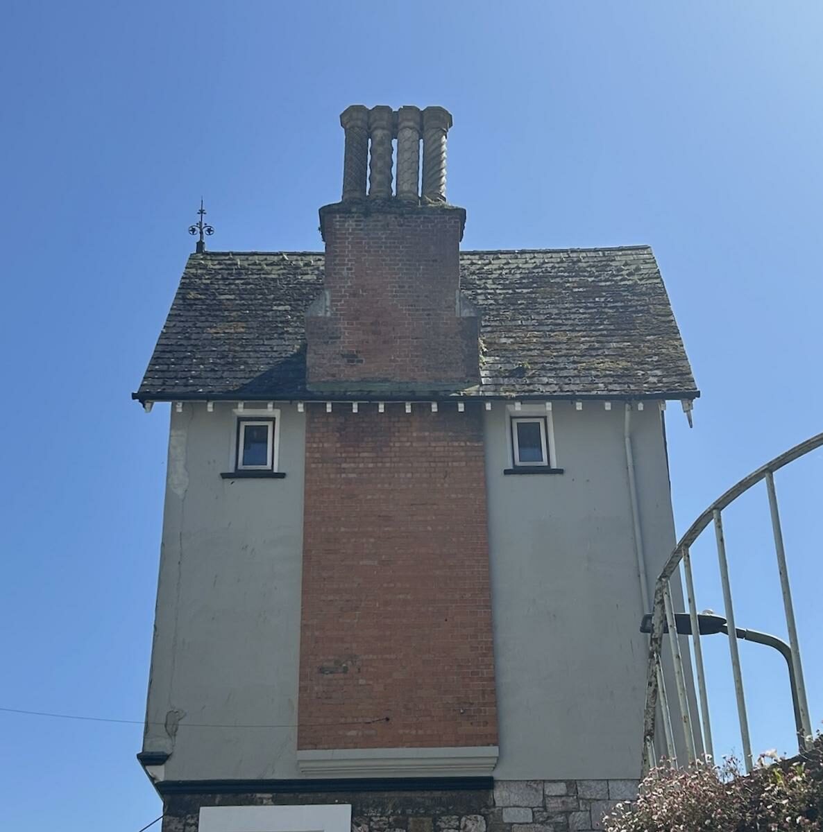 I don’t really know what the alt text for this should be. It’s a picture of a house. And it looks like a Minecraft Villager. Do you want more?